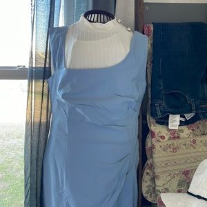 Light blue dress zipper in the back. No sleeves